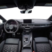 Inside moden car background, luxury car interior elements wallpaper. Empty car with transparent outside background, png illustration. Black leather car interior