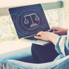 Legal Tech Studium Justice theme with woman using her laptop in her home office