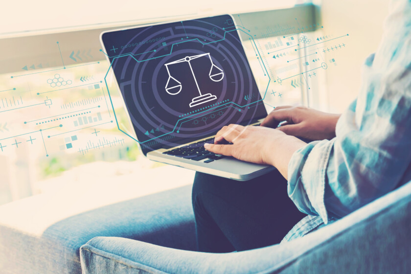 Legal Tech Studium Justice theme with woman using her laptop in her home office