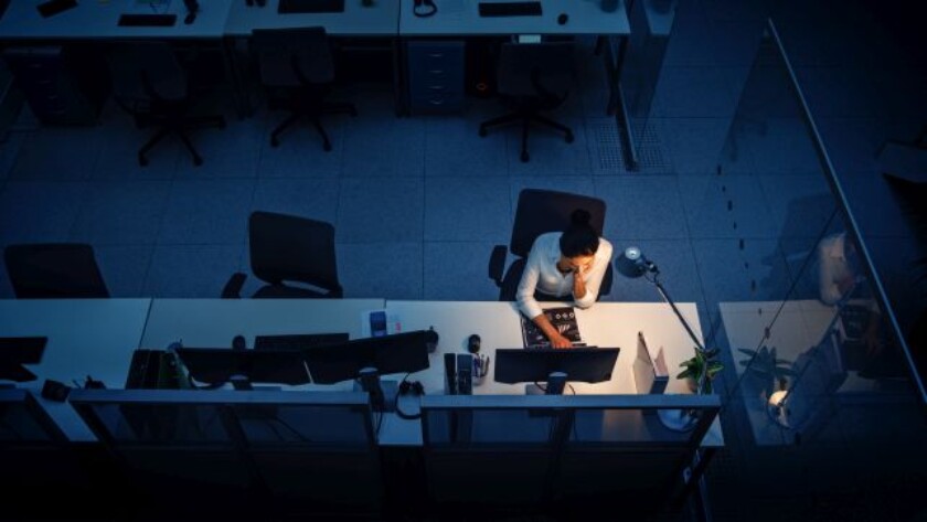 Working Late at Night in the Office: Businesswoman Using Desktop Computer, Analyzing, Using Documents, Solving Problems, Finishing Project. High Angle Shot