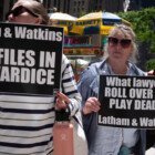 Members of the group Rise and Resist and their allies gather for a weekly ''cowardly law-firm crawl'' to three different firms in Midtown Manhattan, on May 20, 2025. The three firms are Latham & Watkins, Paul, Weiss, and Willkie Farr, all of which enter into agreements with the Trump administration to avoid being the targets of punishing executive orders. Many view these agreements as a capitulation to President Trump. (Photo by Melissa Bender/NurPhoto)