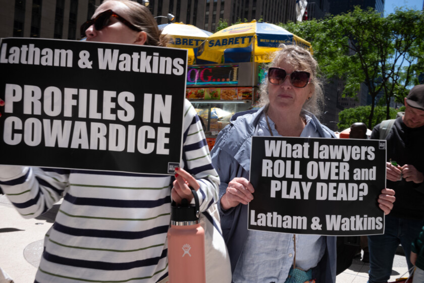 Members of the group Rise and Resist and their allies gather for a weekly ''cowardly law-firm crawl'' to three different firms in Midtown Manhattan, on May 20, 2025. The three firms are Latham & Watkins, Paul, Weiss, and Willkie Farr, all of which enter into agreements with the Trump administration to avoid being the targets of punishing executive orders. Many view these agreements as a capitulation to President Trump. (Photo by Melissa Bender/NurPhoto)