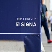 Munich, Germany - 06 23 2023 - Sign of the insolvent real estate company Signa on the construction site of the Karstadt building in Munich.
