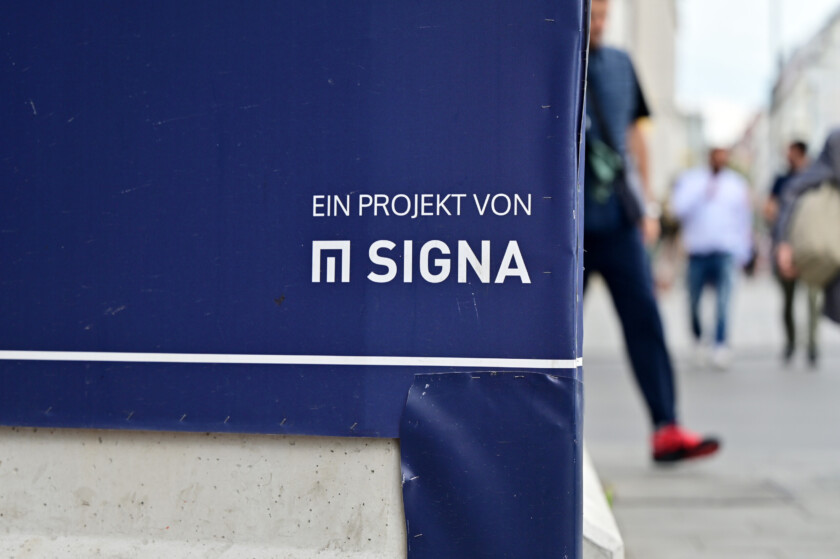 Munich, Germany - 06 23 2023 - Sign of the insolvent real estate company Signa on the construction site of the Karstadt building in Munich.