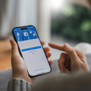 CHIANG MAI, THAILAND - APR 16, 2023: Facebook social media app logo on log-in, sign-up registration page on mobile app screen on iPhone 14 in person's hand working on e-commerce shopping business